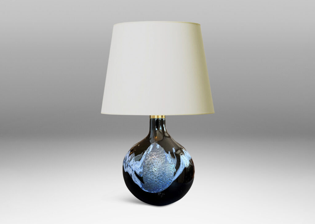 oblong forms with offset sprouting necks, in black with wavy nacreous collar