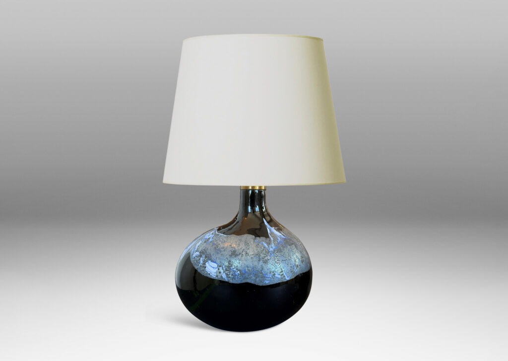 oblong forms with offset sprouting necks, in black with wavy nacreous collar