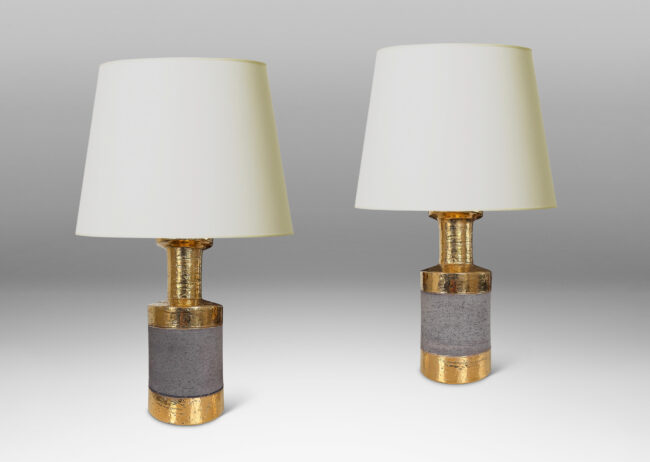 Gallery BAC canister forms with recessed necks and flange tops with a grog texture, glazed in gold luster and matte brown