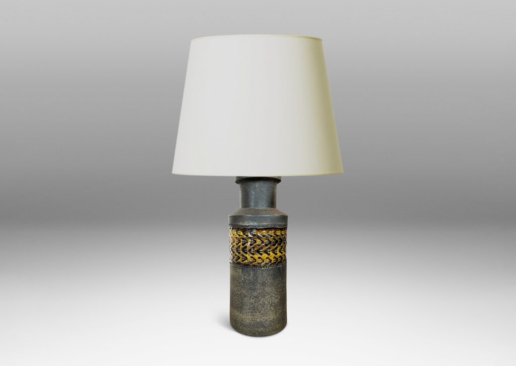 Gallery BAC rationalized canister form in matte brown, with wide bands with impressed ornaments glazed in a gloss coffee brown
