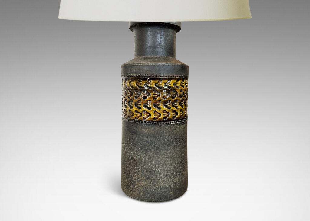 Gallery BAC rationalized canister form in matte brown, with wide bands with impressed ornaments glazed in a gloss coffee brown