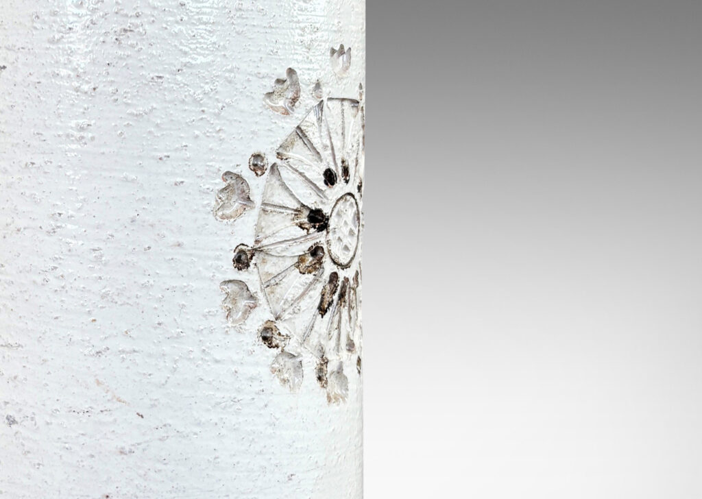 Gallery BAC textured cylindrical canister form, with wide necks and flange caps, and impressed rosette motifs, glazed in a shiny ivory