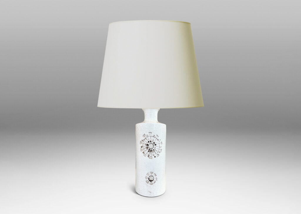 Gallery BAC textured cylindrical canister form, with wide necks and flange caps, and impressed rosette motifs, glazed in a shiny ivory