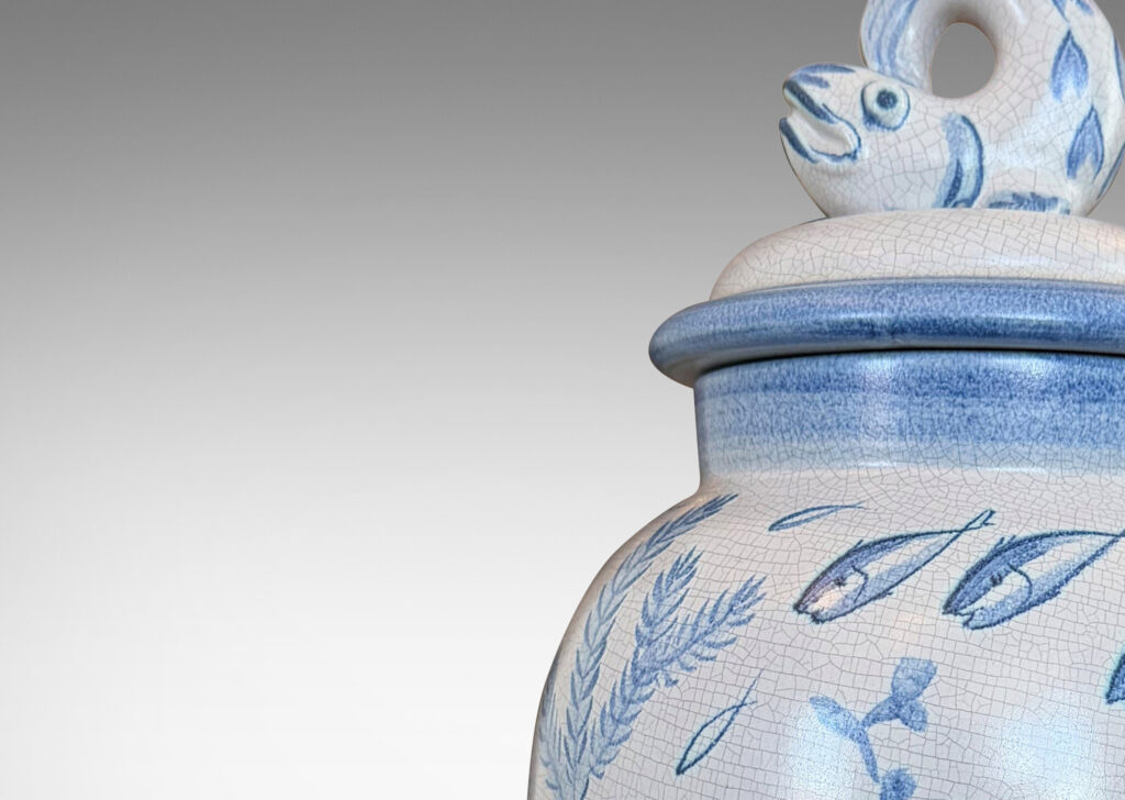 Gallery BAC tall ovoid form with fish form finial, glazed in a craquel very pale gray, surrounded with charming hand-painted pictures of marine flora and fauna in blue