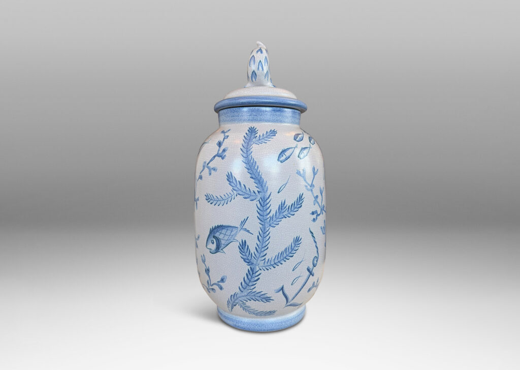 Gallery BAC tall ovoid form with fish form finial, glazed in a craquel very pale gray, surrounded with charming hand-painted pictures of marine flora and fauna in blue