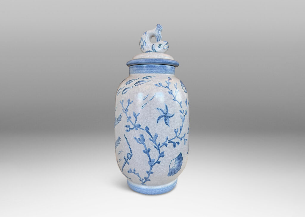Gallery BAC tall ovoid form with fish form finial, glazed in a craquel very pale gray, surrounded with charming hand-painted pictures of marine flora and fauna in blue