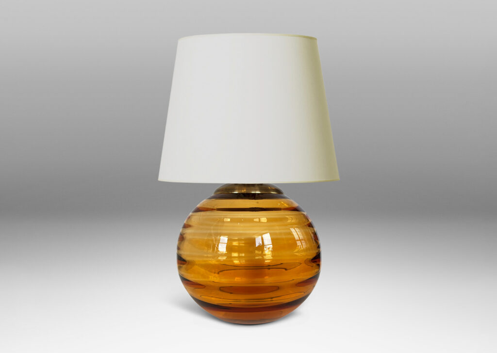 Gallery BAC globe form with internal horizontal banding, hand-blown in orange tint glass, brass mount