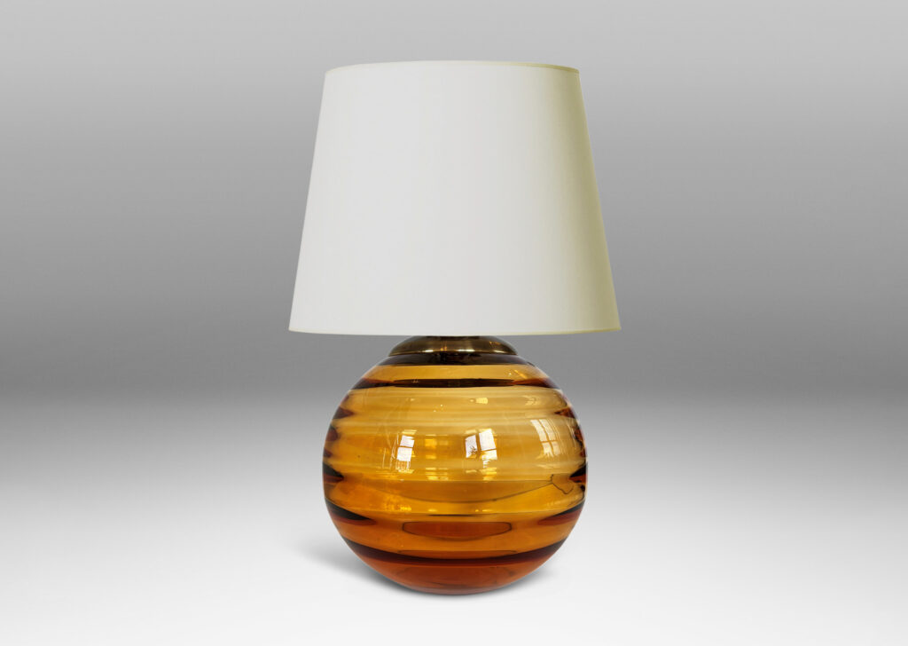 Gallery BAC globe form with internal horizontal banding, hand-blown in orange tint glass, brass mount