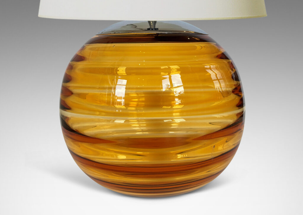 Gallery BAC globe form with internal horizontal banding, hand-blown in orange tint glass, steel mount