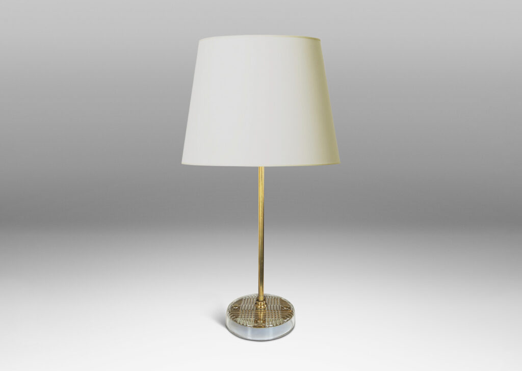 Gallery BAC disk bases in glass with reverse-cut crosshatch pattern, backed by a brass for a shimmering gold effect, with slender brass stands