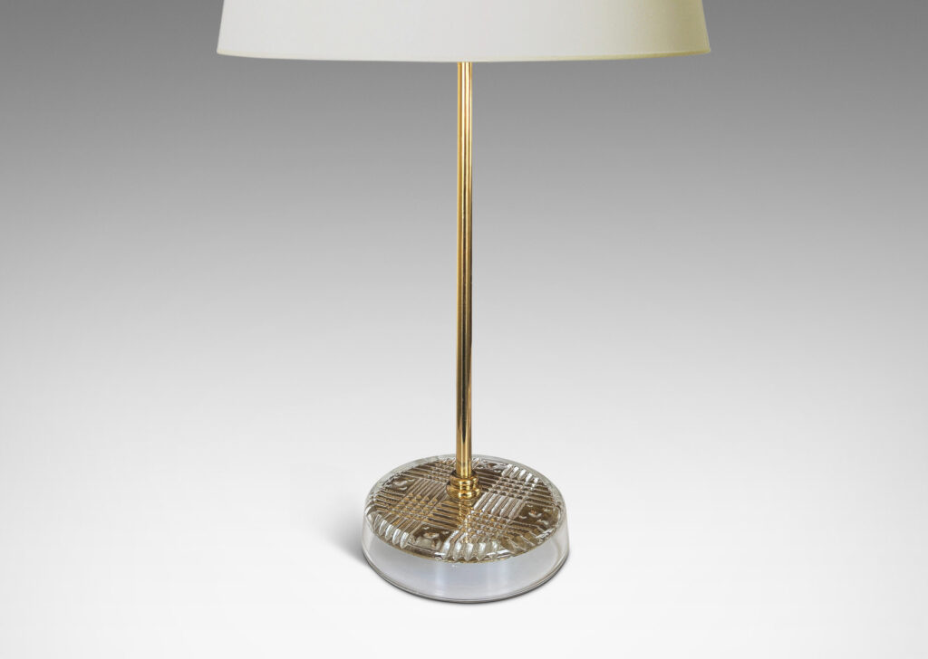 Gallery BAC disk bases in glass with reverse-cut crosshatch pattern, backed by a brass for a shimmering gold effect, with slender brass stands