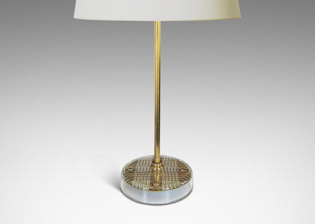 Gallery BAC disk bases in glass with reverse-cut crosshatch pattern, backed by a brass for a shimmering gold effect, with slender brass stands