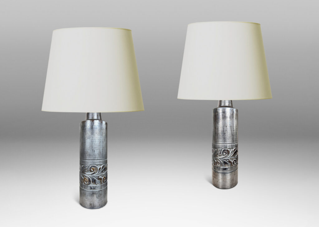 Gallery BAC columnar forms with relief bands of folk foliage, glazed in luster brown