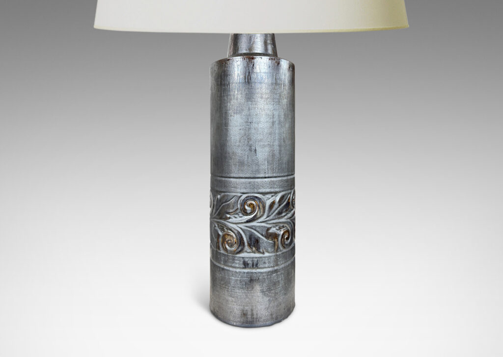 Gallery BAC columnar forms with relief bands of folk foliage, glazed in luster brown