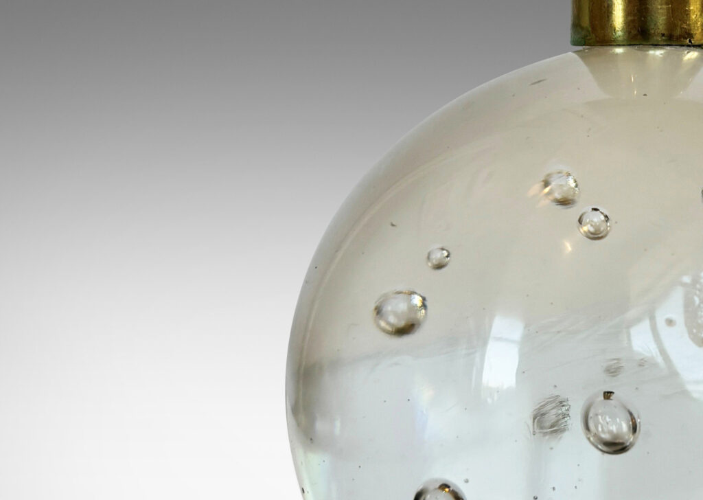 Gallery BAC hand-formed bubble glass spheres with cuff sockets; crystal and brass