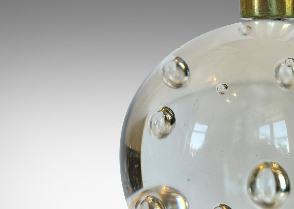 Gallery BAC hand-formed bubble glass spheres with cuff sockets; crystal and brass