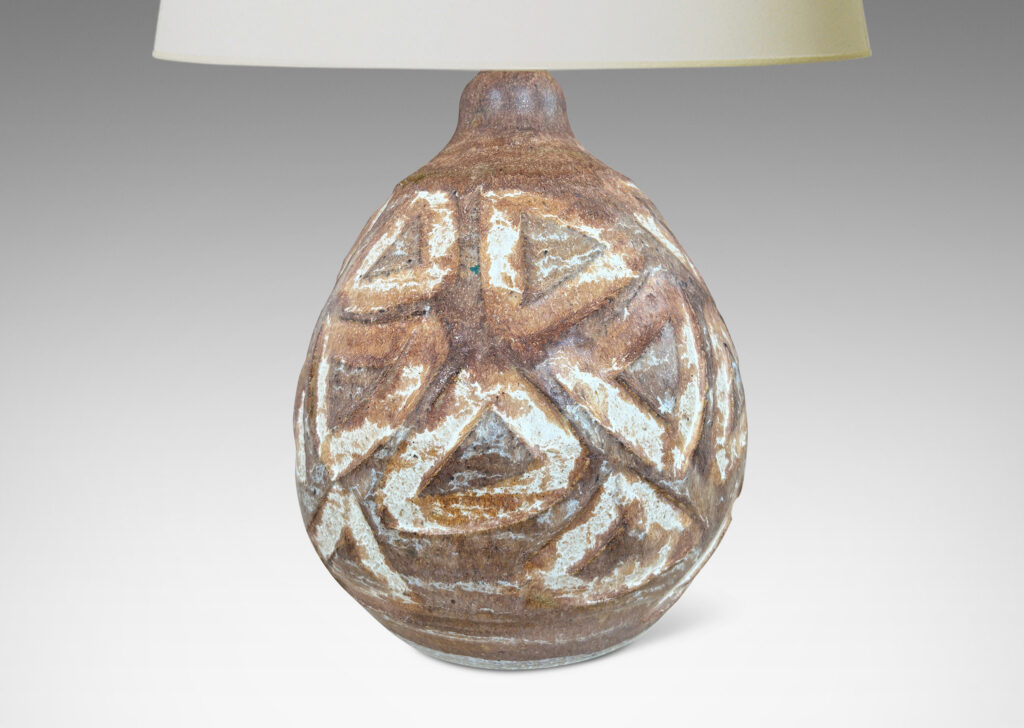 Gallery BAC ovoid form encircled in carved triangle motifs, glazed in warm and cool brown tone