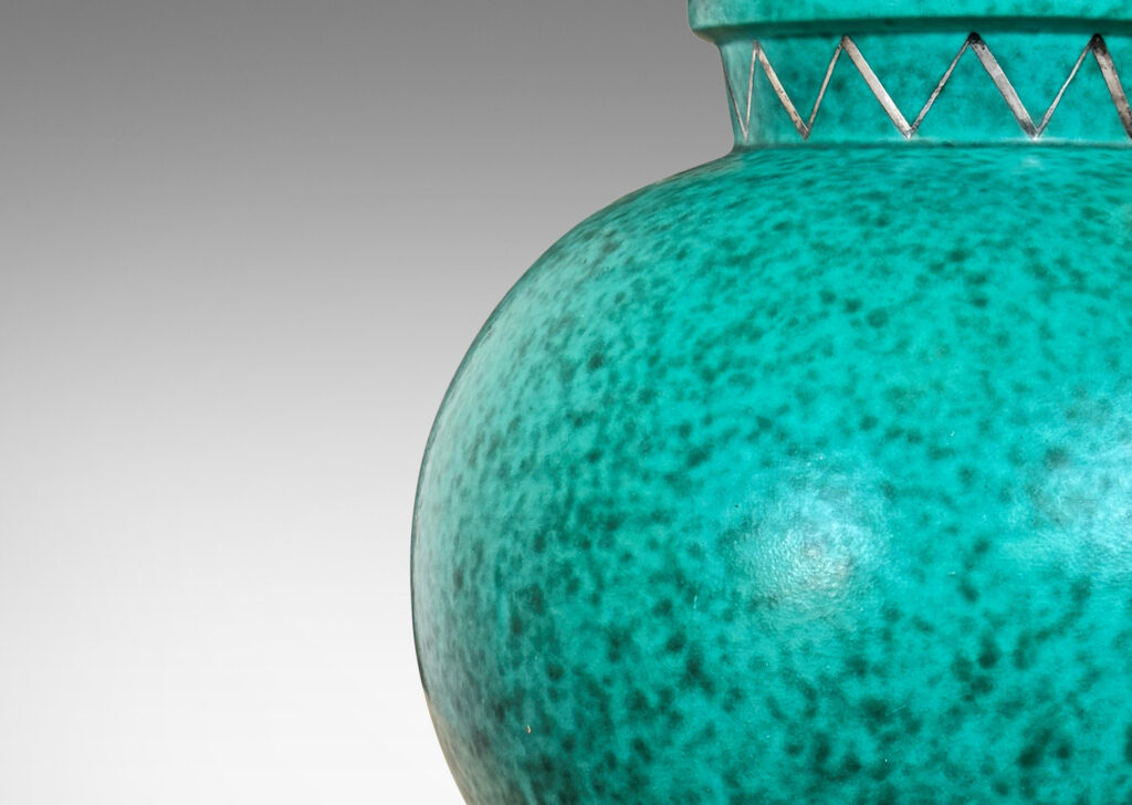 Gallery BAC plump globe form with flanged neck and base, glazed in a mottled blue-green
