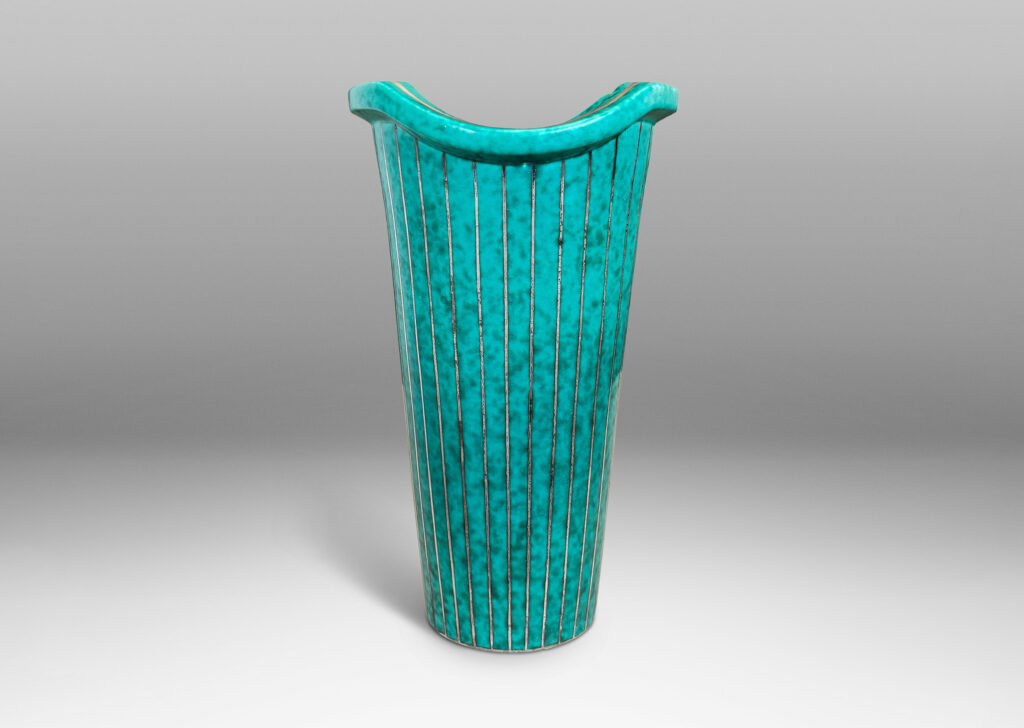 Gallery BAC tapered cylindrical form with a flanged and notched lip, glazed in a mottled blue-green