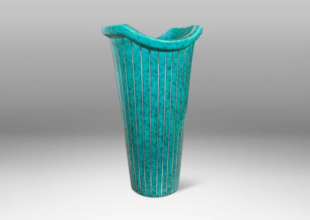 Gallery BAC tapered cylindrical form with a flanged and notched lip, glazed in a mottled blue-green