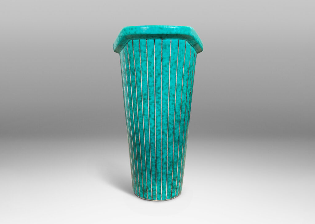 Gallery BAC tapered cylindrical form with a flanged and notched lip, glazed in a mottled blue-green
