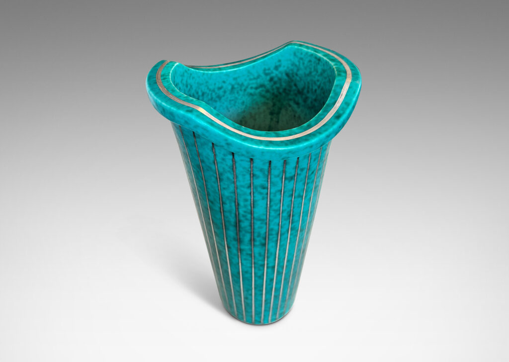 Gallery BAC tapered cylindrical form with a flanged and notched lip, glazed in a mottled blue-green