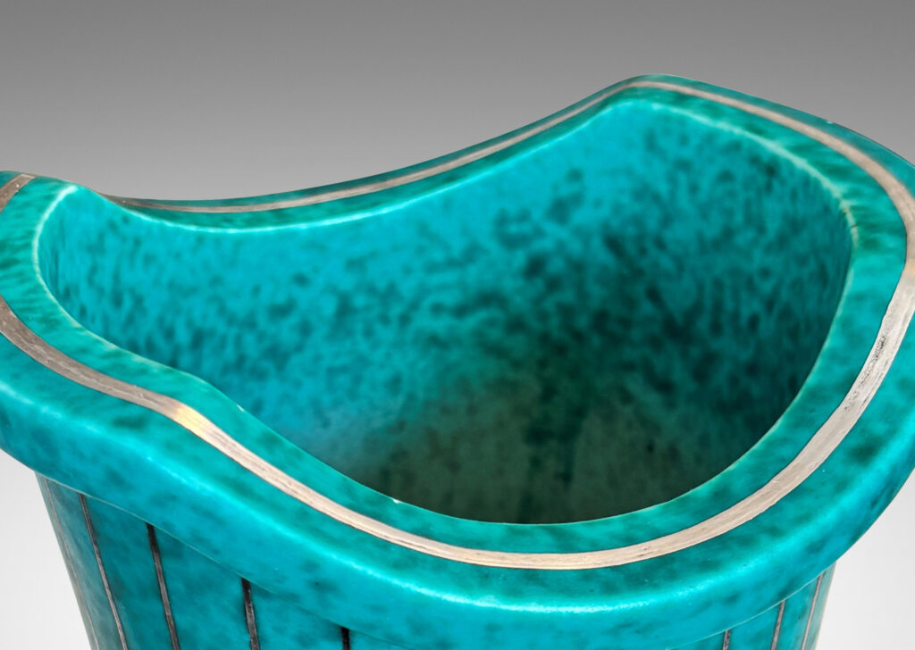 Gallery BAC tapered cylindrical form with a flanged and notched lip, glazed in a mottled blue-green