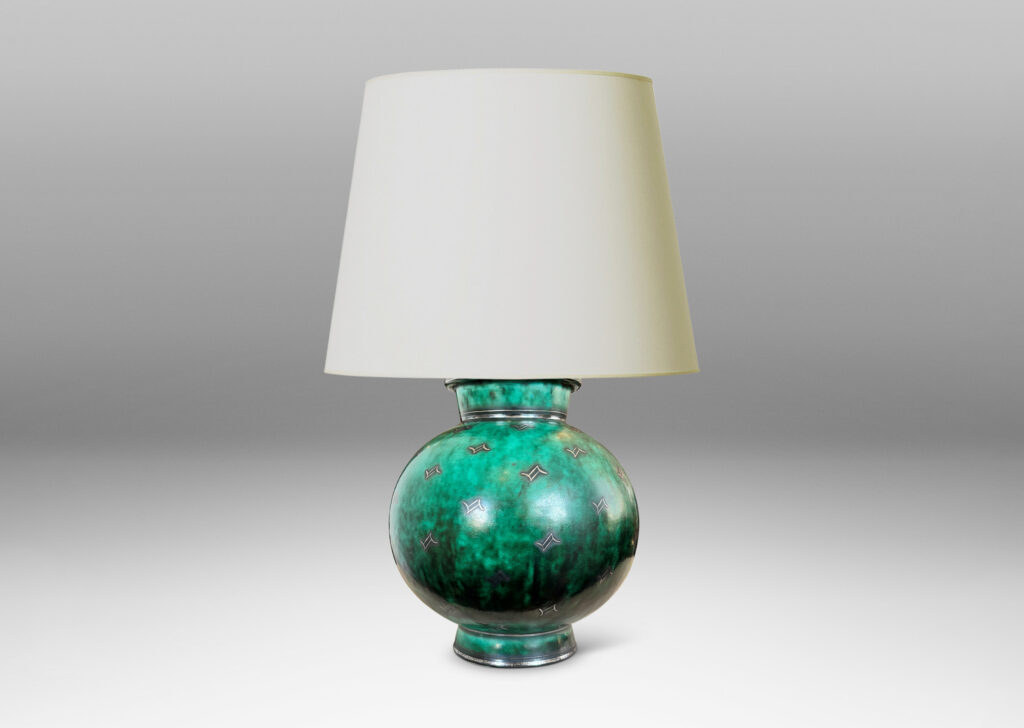 Gallery BAC globe form with flanged neck and base, glazed in a vivid mottled blue-green, with inlaid bands and floating motifs