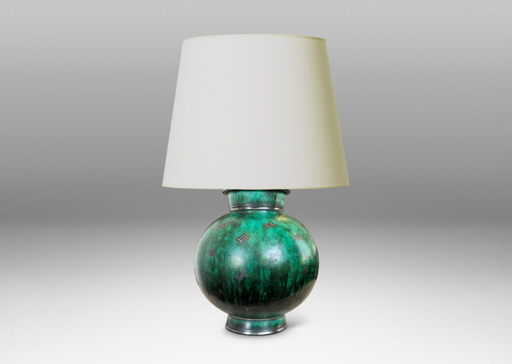 Gallery BAC globe form with flanged neck and base, glazed in a vivid mottled blue-green, with inlaid bands and floating motifs