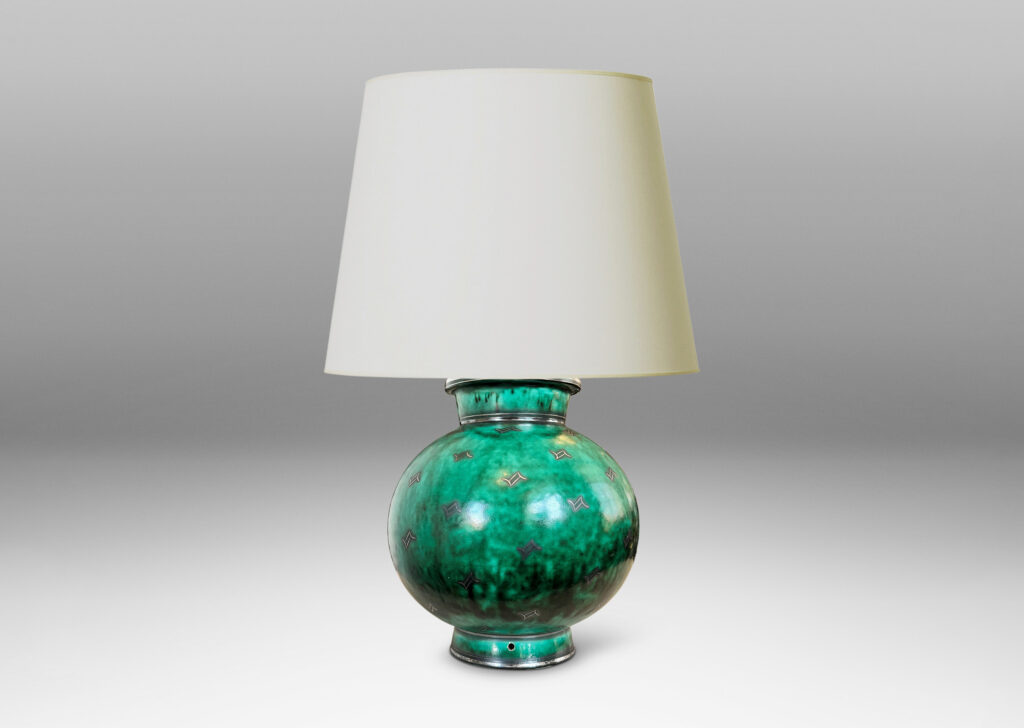 Gallery BAC globe form with flanged neck and base, glazed in a vivid mottled blue-green, with inlaid bands and floating motifs