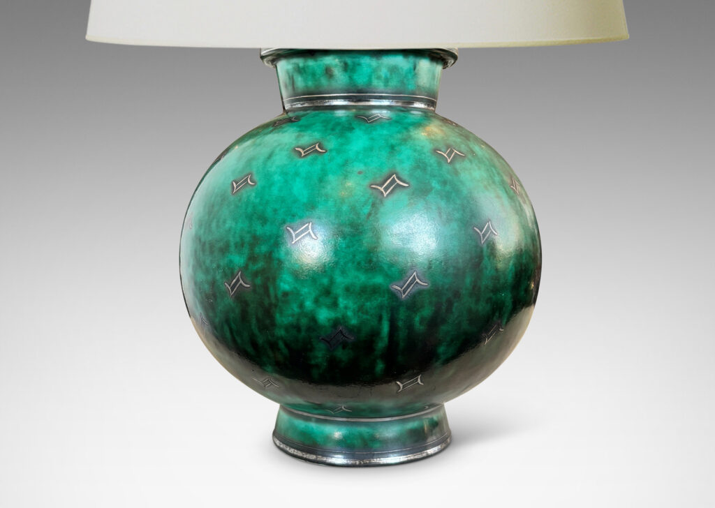 Gallery BAC globe form with flanged neck and base, glazed in a vivid mottled blue-green, with inlaid bands and floating motifs