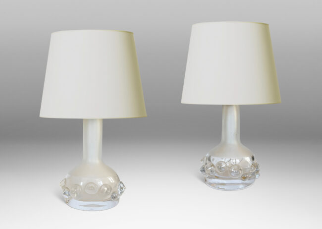 Gallery BAC decanter forms with attenuated necks and applied relief of demi-spheres in clear glass