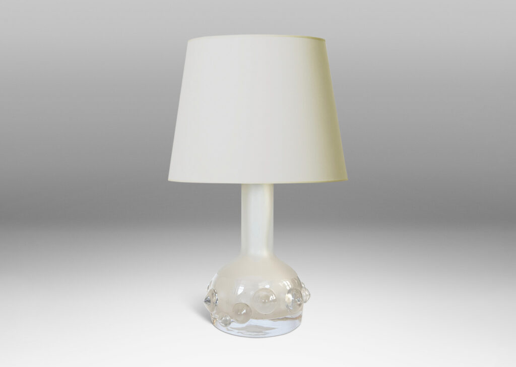 Gallery BAC decanter forms with attenuated necks and applied relief of demi-spheres in clear glass