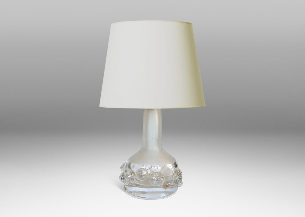 Gallery BAC decanter forms with attenuated necks and applied relief of demi-spheres in clear glass