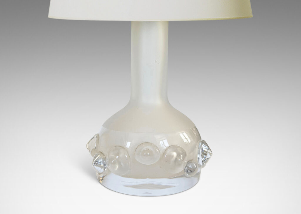Gallery BAC decanter forms with attenuated necks and applied relief of demi-spheres in clear glass