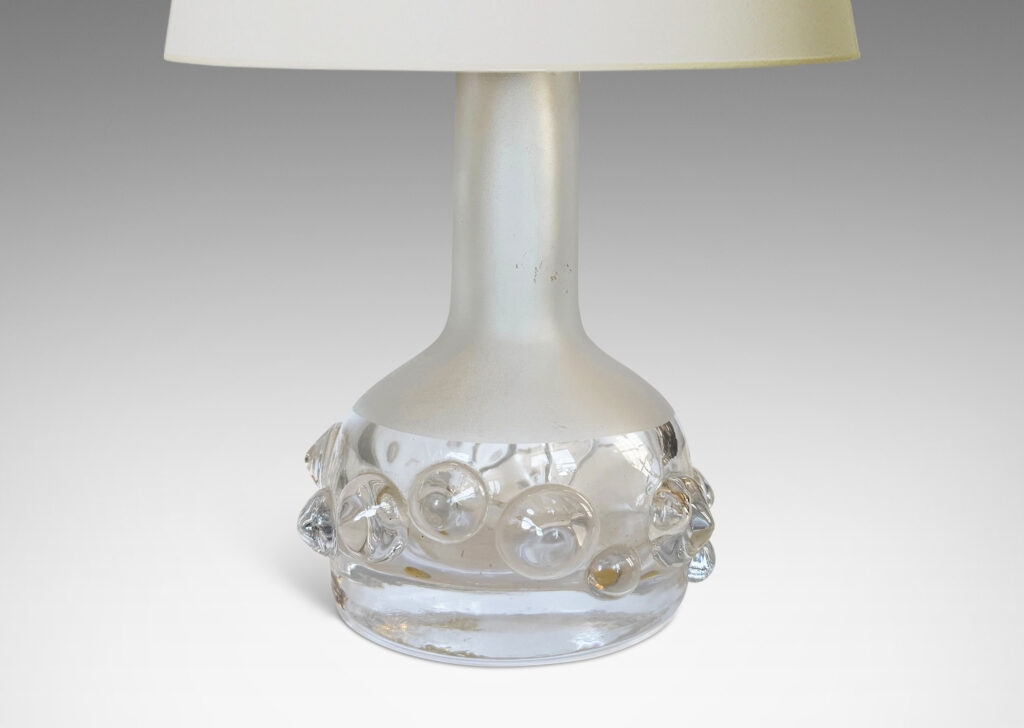 Gallery BAC decanter forms with attenuated necks and applied relief of demi-spheres in clear glass