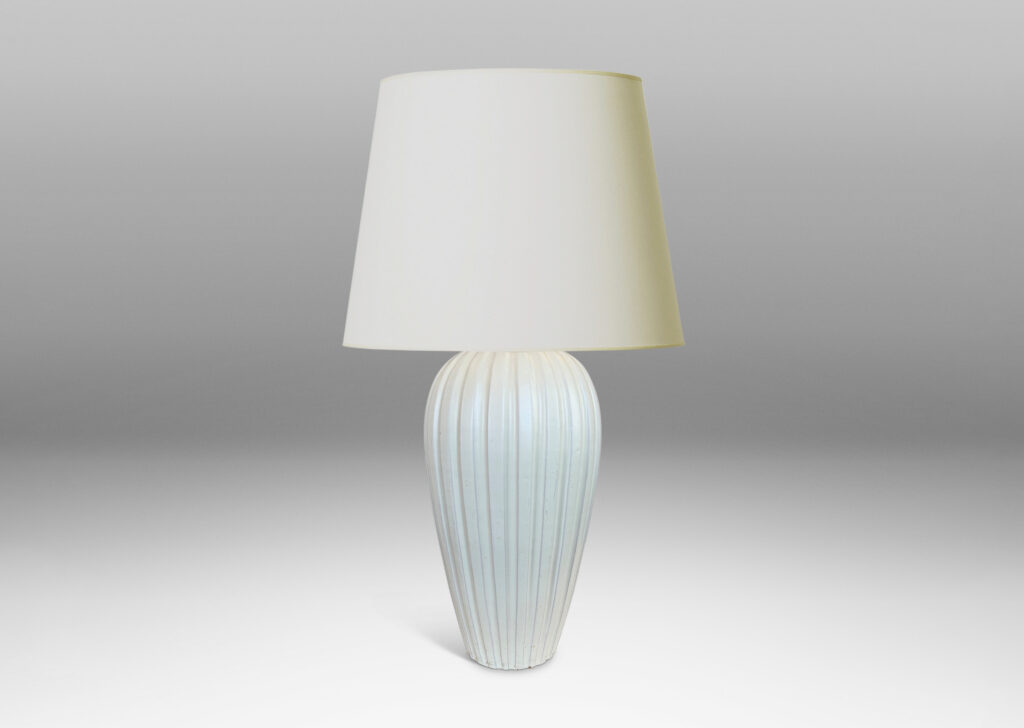 Gallery BAC vertically fluted tapering form in an eggshell finish pale ivory glaze
