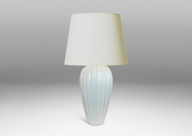 Gallery BAC vertically fluted tapering form in an eggshell finish pale ivory glaze