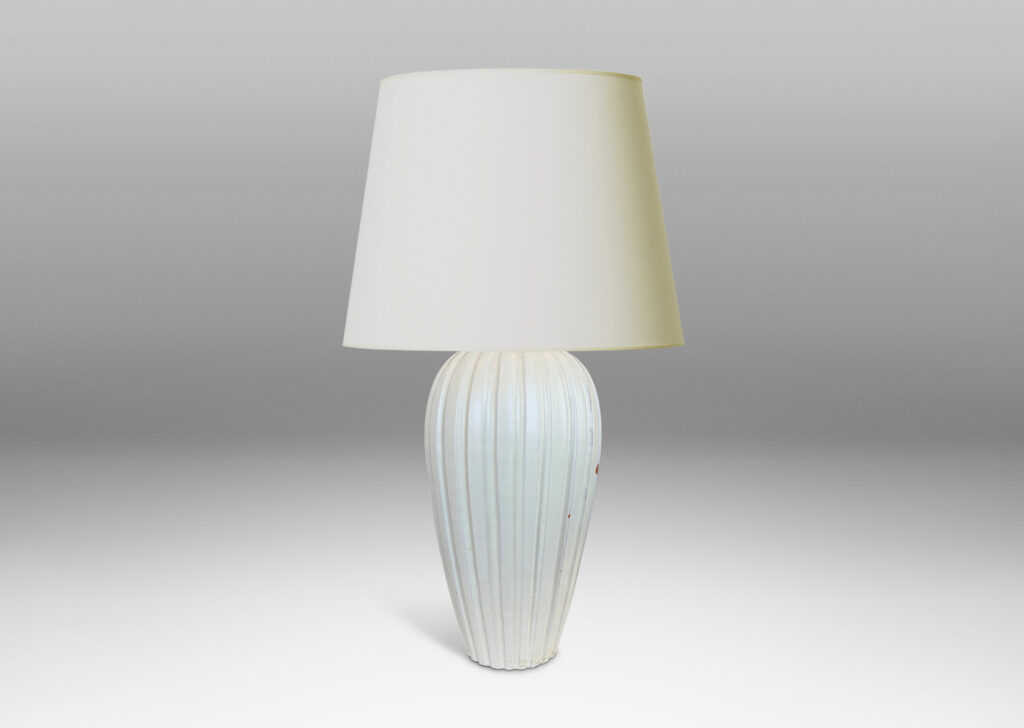 Gallery BAC vertically fluted tapering form in an eggshell finish pale ivory glaze