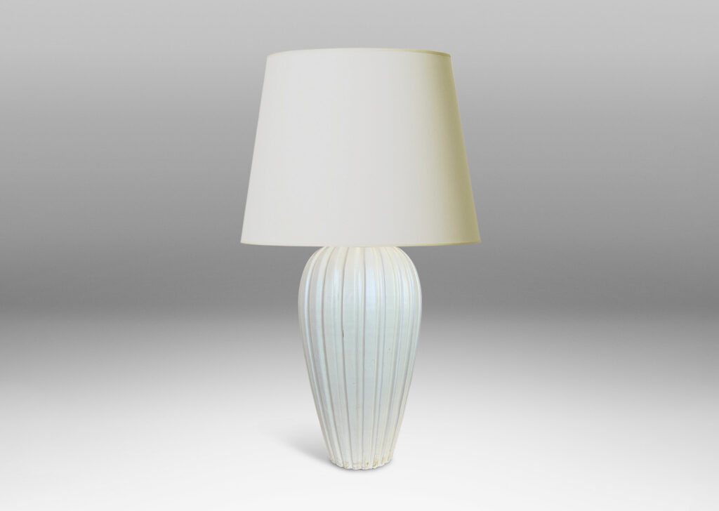 Gallery BAC vertically fluted tapering form in an eggshell finish pale ivory glaze