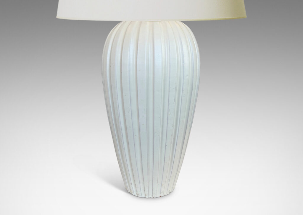 Gallery BAC vertically fluted tapering form in an eggshell finish pale ivory glaze