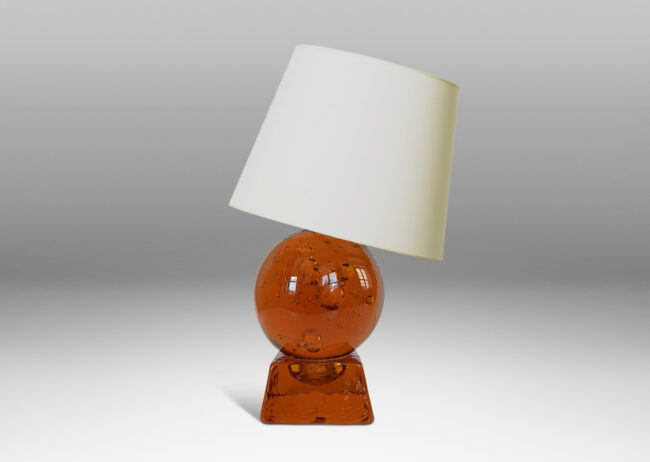 Gallery BAC amber tinted adjustable small globe with encased bubbles resting on a raked square base