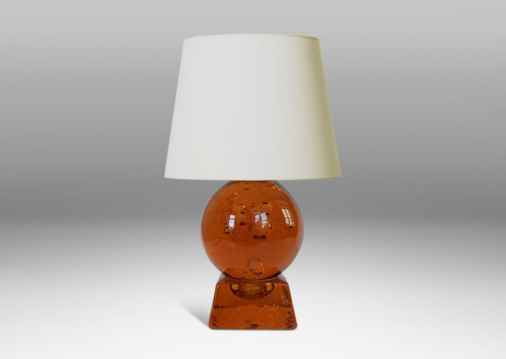 Gallery BAC amber tinted adjustable small globe with encased bubbles resting on a raked square base