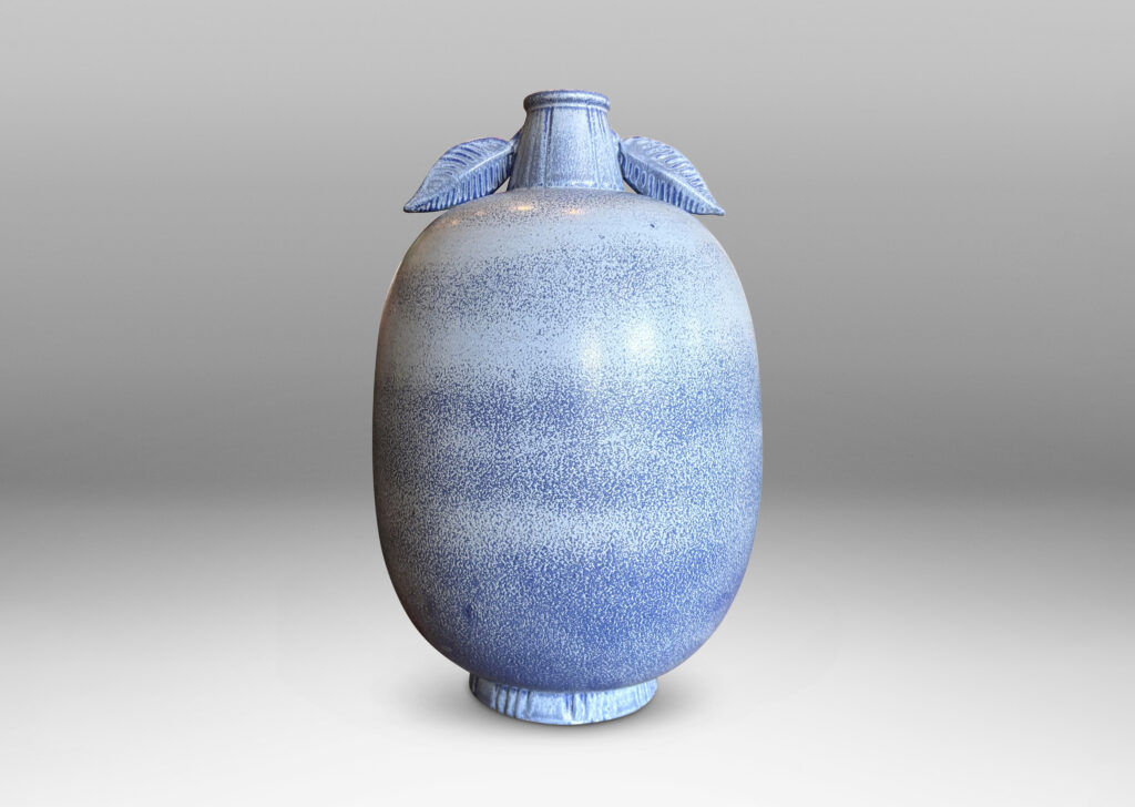 Gallery BAC ovoid form with stem-like neck and leaves in high relief, glazed in light to deep tonal French blue