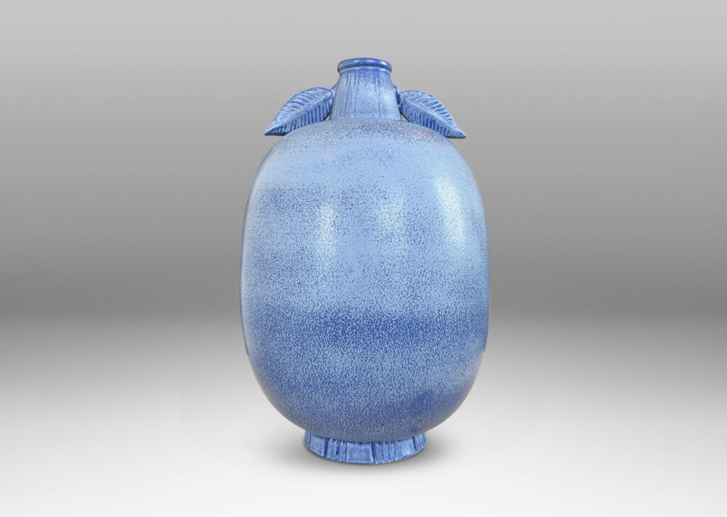Gallery BAC ovoid form with stem-like neck and leaves in high relief, glazed in light to deep tonal French blue