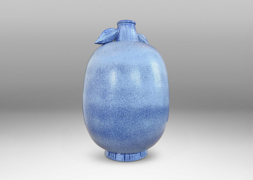 Gallery BAC ovoid form with stem-like neck and leaves in high relief, glazed in light to deep tonal French blue