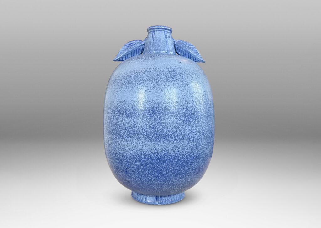 Gallery BAC ovoid form with stem-like neck and leaves in high relief, glazed in light to deep tonal French blue