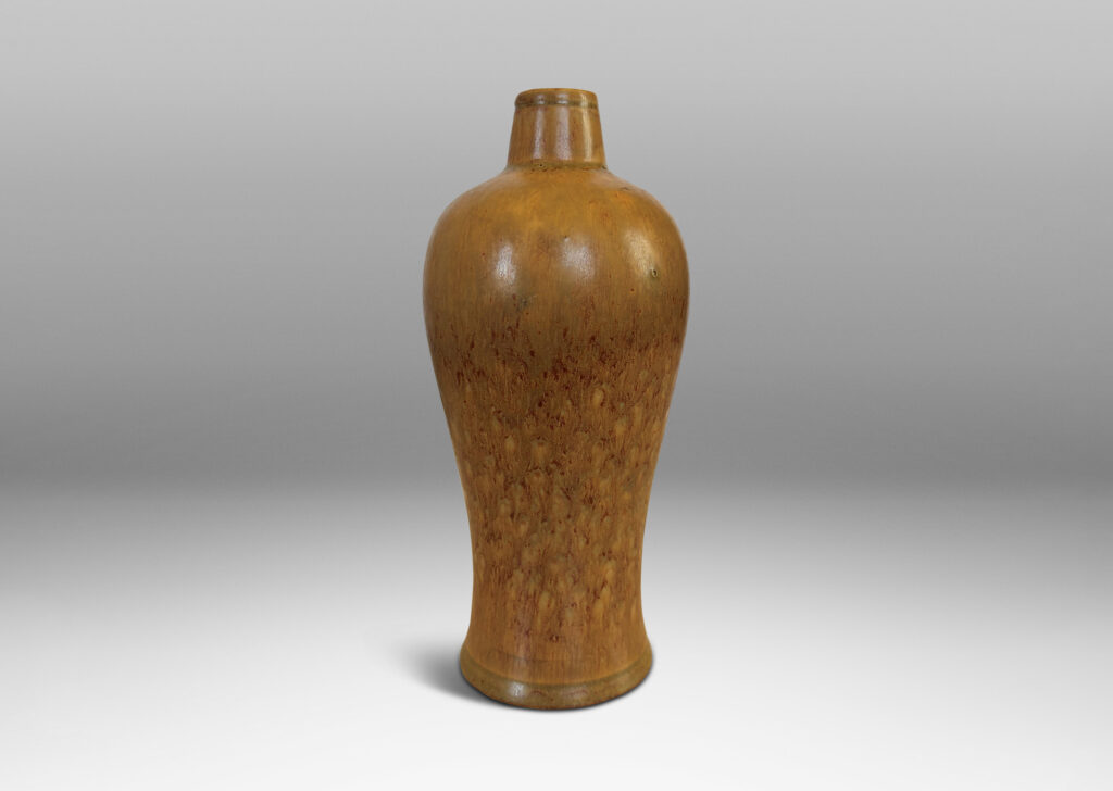 Gallery BAC sinuous form with swelling shoulders and a small conical neck, glazed in eggshell finish ochre-tan with red-brown