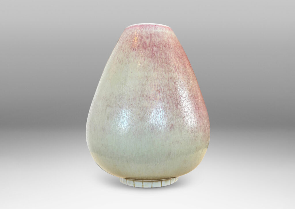 Gallery BAC bulbous form on a notched disk reveal, glazed in ochre-tan and hints of burnt sienna
