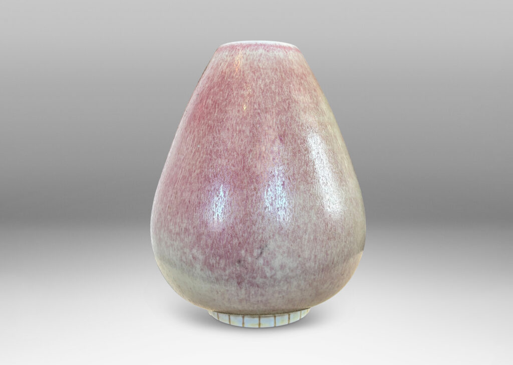 Gallery BAC bulbous form on a notched disk reveal, glazed in ochre-tan and hints of burnt sienna